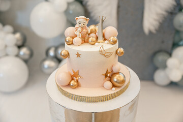 Festive luxury cake for a one-year-old child's birthday. Gold balls and na tural ingredients