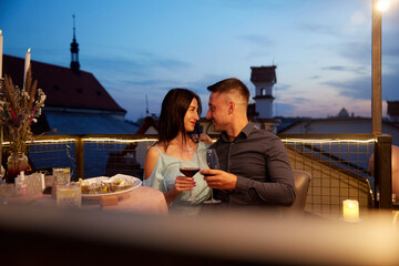 Man and Woman hold glass of wine. Concept for valentine day or date.