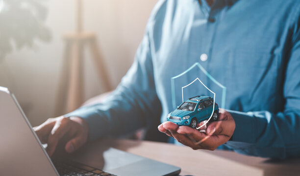 assurance, insurance, investment, protection, service, transport, vehicle, care, finance, safety. hands protecting toy car on palm. plan to manage insurance costs. Concept of car insurance business.