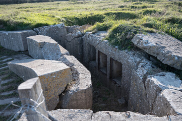 Entrance of German World War 2 concrete bunker with concrete french at Pointe du Hoc,...