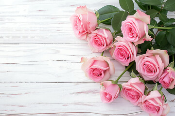 Fototapeta na wymiar Pink roses on vintage white wood background,top view, embodying love, nature, and the romantic of Valentine's Day with copy space for your text or product display.World Rose Day Concept.