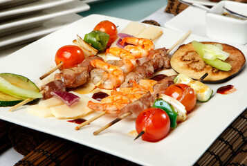 Asian cuisine. Meat, vegetable and seafood skewers