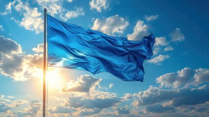  a blue flag blowing in the wind under a cloudy blue sky with the sun peeking through the clouds and the sun peeking through the clouds behind the blue sky with white clouds.