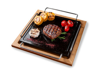 Grilled filet mignon steak with tomatoes and corn. Lunch. Isolated.