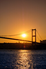 Istanbul. Bosphorus bridge at sunset, view of the European part of the city