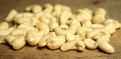 cashew nuts on wooden background, close-up, macro

