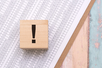 exclamation point on wooden cube, education and business concept, searching for answers, thoughts...