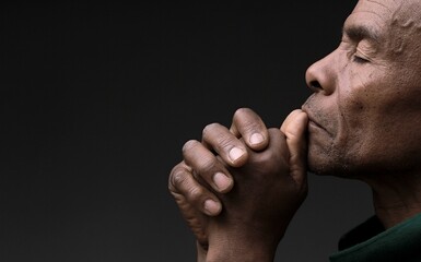 praying to god with black grey background with people stock image stock photo