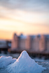 pile of snow on the sunset over the river in oslo norawy