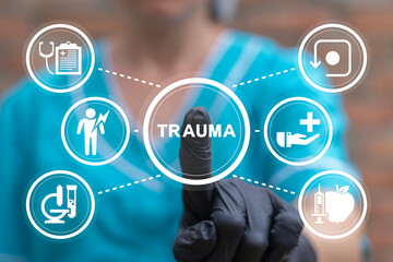 Doctor using virtual touch screen presses text: TRAUMA. Physical or mental or psychological injury...