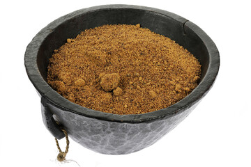 palm sugar in a wooden bowl isolated on white background