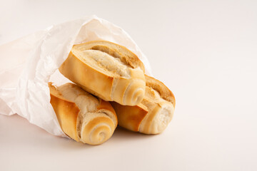 Fresh baked flour bread in white clean background in front view photo with blank space
