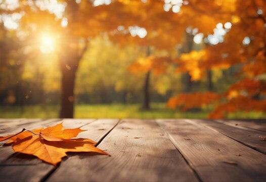 Autumn maple leaves on wooden table top Falling leaves natural background Sunny autumn day with beau