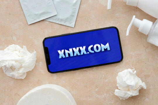 KYIV, UKRAINE - JANUARY 23, 2024 XNXX adult content website logo on display of iPhone 12 Pro smartphone