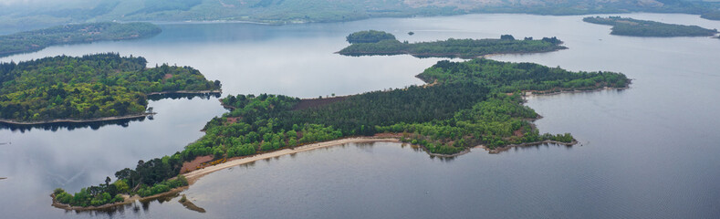 Loch Lomond aerial view showing islands Inchtavannach, Inchconnachan, Inchcruin and Inchfad