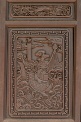 Fototapeta na wymiar Decorative Buddhist Wood Carvings in Vietnam