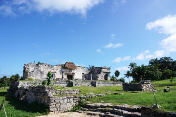 Fototapeta na wymiar Tulum, Quintana Roo, Mexico - December 15, 2023: View of The Great Palace ruins at Tulum, The Maya City of the Dawning Sun.