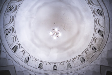Domed roof ceiling vault in an ancient bazaar building in the ancient city of Bukhara in Uzbekistan, interior