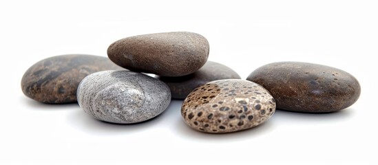Fototapeta na wymiar Tranquil Relaxation: Serene Pebbles on a White Background for Ultimate Relaxation