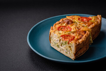 Delicious quiche with tomato, cheese, chicken, spices and herbs