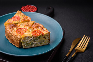 Delicious quiche with tomato, cheese, chicken, spices and herbs