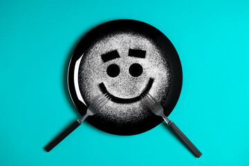 Smiling face, concept made with plate and flour, cyan background, star shaped eyes, black plate, happy mood, facial expressions, forks in the shape of arms with different positions