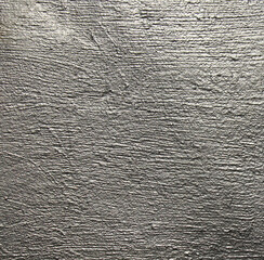 Silver metallic wall, background, texture. Uneven, grooved and embossed silvery backdrop. Grey...