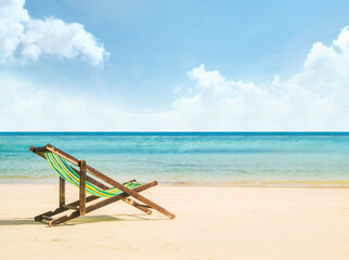 Lounge chairs on a tropical beach at summer