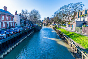 A view southward down the River Welland in Spalding, Lincolnshire on a bright sunny day