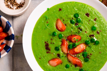 Green pea soup with sausages.style hugge.selective focus