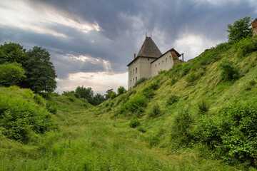 Fototapeta na wymiar Medieval Halych Castle under stormy sky in Ukraine.