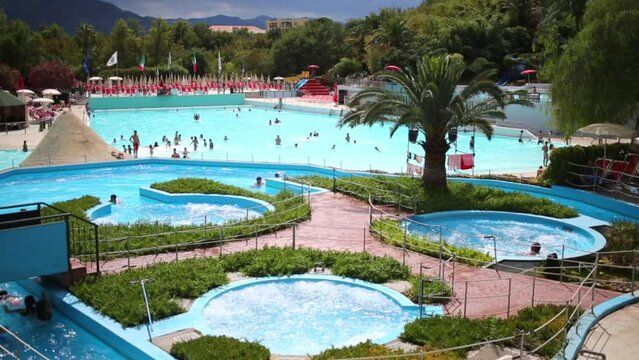People swims in swimming pools in the water park Le Caravelle