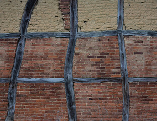  old timber framing  brick wall