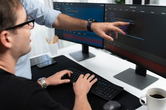 IT developers creating online software development information on screen laptop with coding program in data of application and website. Technical engineer coder on safety program concept. Sellable.