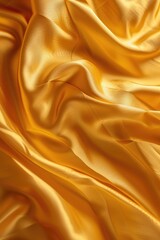 Fototapeta premium A detailed close up view of golden silk fabric. Perfect for fashion and textile design projects