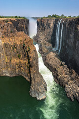 Victoria Falls on the Zambezi River on the border of Zambia and Zimbabwe in South Africa - obrazy, fototapety, plakaty