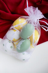 Easter card mockup made of Easter eggs, spring flowers and space for text	