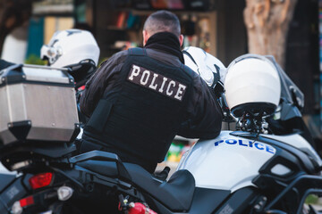 Police squad formation on duty riding bike and motorcycle, maintain public order in the european city streets, group of policemen patrol on motorbikes with 