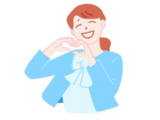 ハンドサインでハートをつくる笑顔の女性