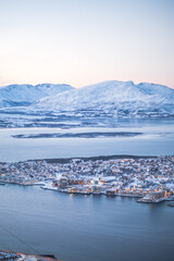 Fototapeta na wymiar Fjellheisen viewpoint over tromso city in north of norway in winter time with the sunset over the fjords