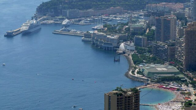 Monte Carlo, Monaco, city traffic on sea shore and port with vessels