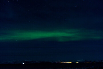 Fototapeta na wymiar Polar lights on s´the winter sky in winter in Norway