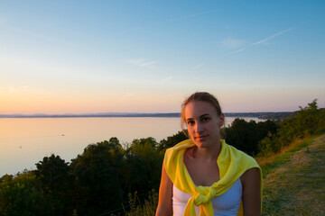 Young woman at sunset at Balatonvilagos near the Lake Balaton