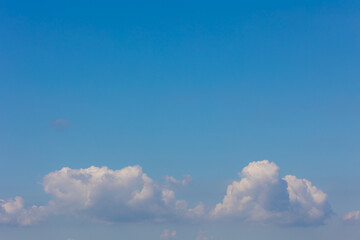 Beautiful white fluffy cloud floating in blue sky in sunny day, Cumulus are clouds which have flat...