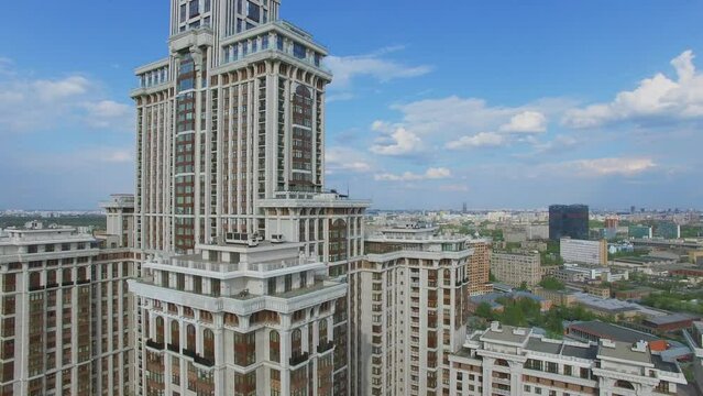 Facade of tall residential house Triumph-Palace against cityscape