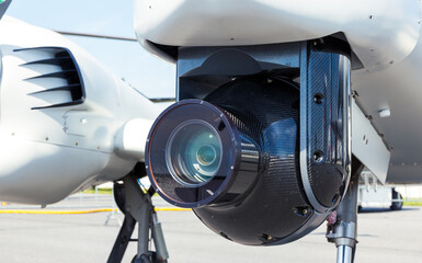 Camera pod under a surveillance aircraft. - obrazy, fototapety, plakaty