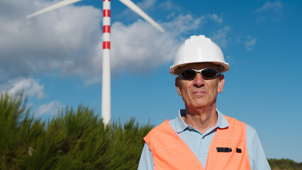 Construction site manager checks the correct installation of the wind turbines