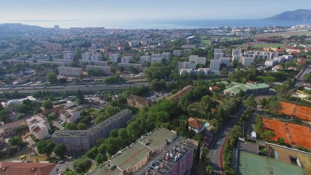 Cityscape with traffic on autostrada near La Bocca Buissons Ardents quarter