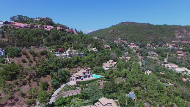 Panorama of hill with villas, Bubbles Palace and port of Figueirette 