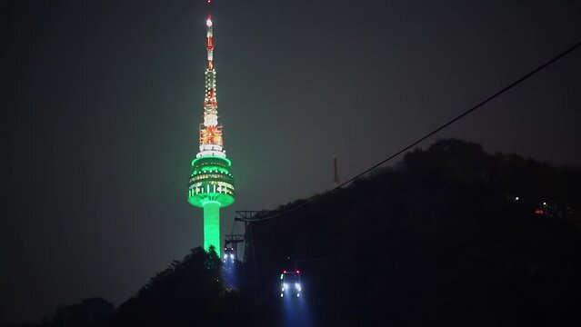 Cabins of cableway ride near Seoul Tower with illumination at autumn night